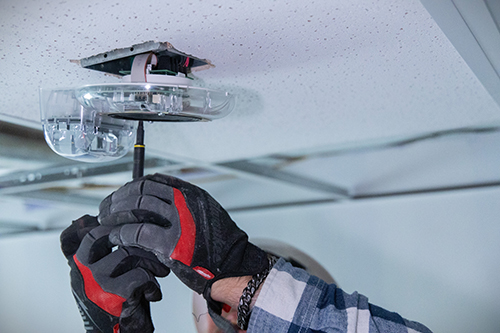 Field leader installing alarm